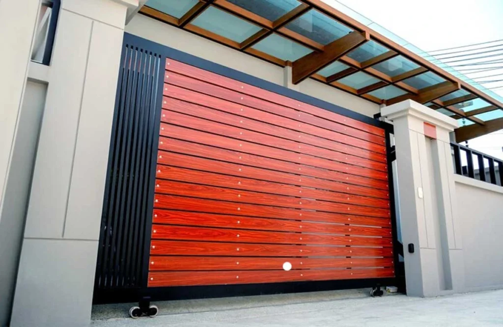 A sleek, modern metal gate with wooden slats, emphasizing the importance of metal gate corrosion prevention for maintaining the gate’s appearance and functionality.
