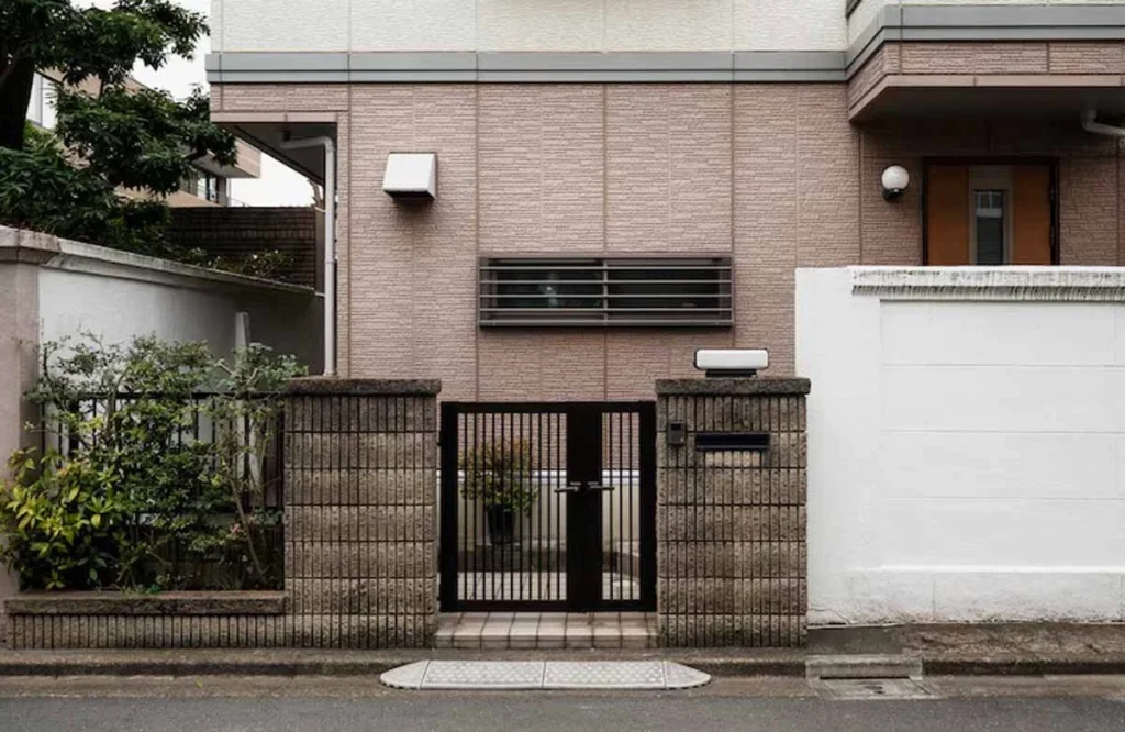 A sleek automatic gate in front of a modern home in Austin, showcasing the convenience and security benefits of choosing an automatic gate for your property.