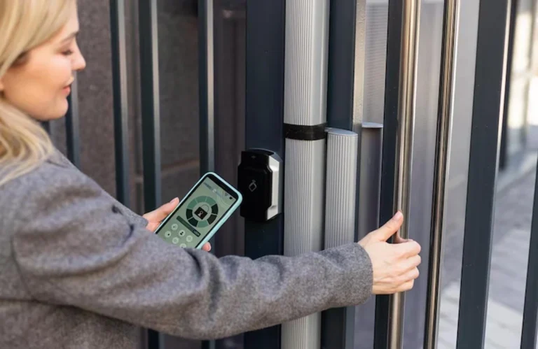 A technician examines an automatic gate in Austin that doesn’t close completely, highlighting the need for professional repair.