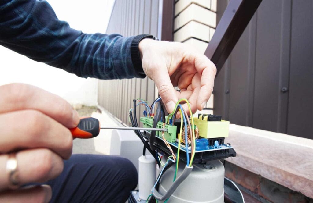 Close-up of photo-eye sensor on automatic gate.