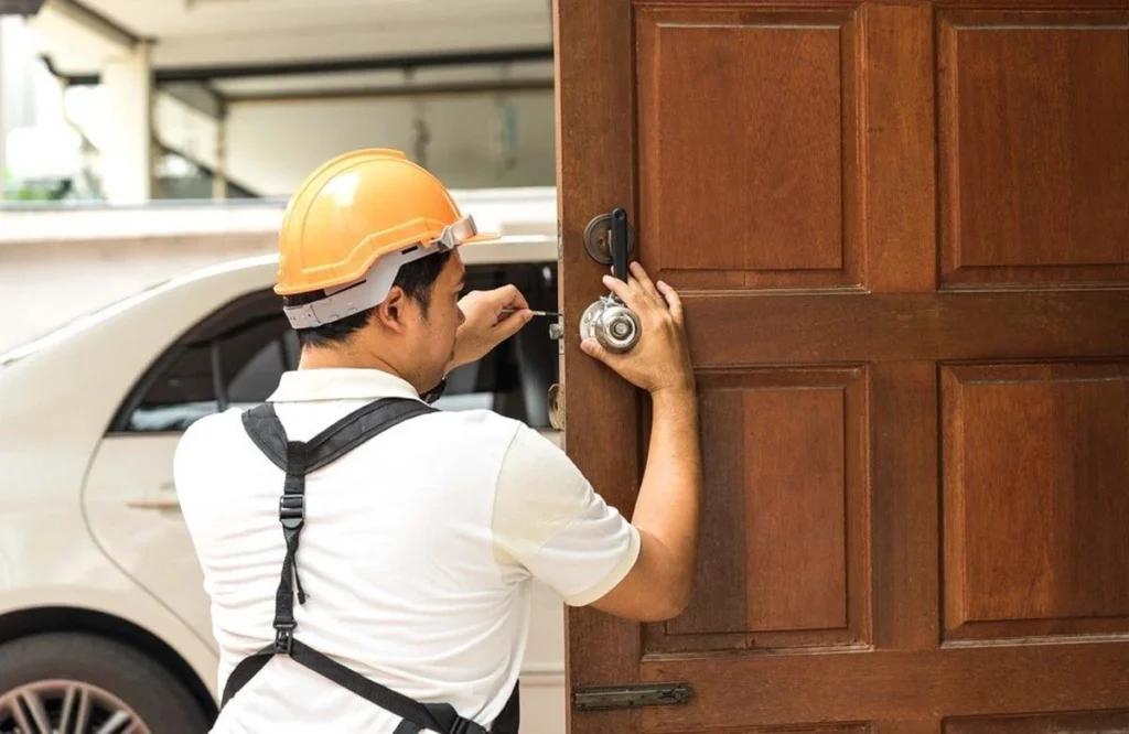  Locksmith repairing door lock in residential setting